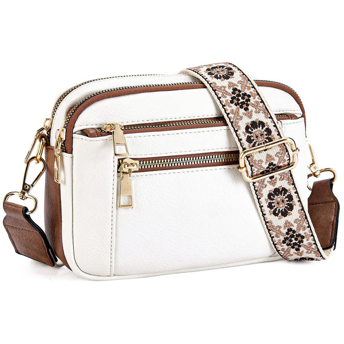 Kobiecza torebka crossbody z wieloma zamkami i nadrukowanym paskiem
