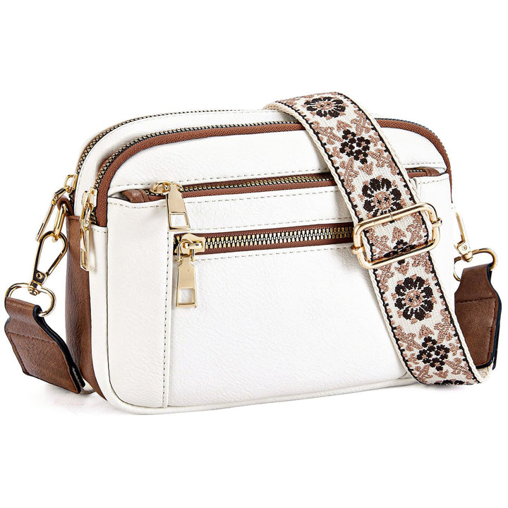 Kobiecza torebka crossbody z wieloma zamkami i nadrukowanym paskiem