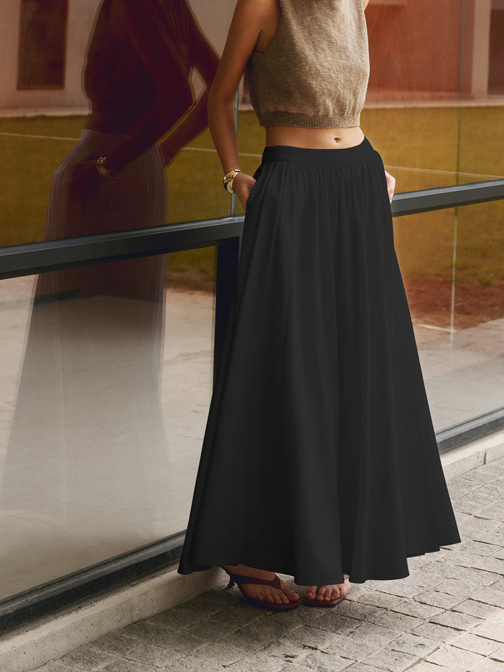 Damska spódnica maxi z wysokim stanem i plisami, elegancka na letnie okazje